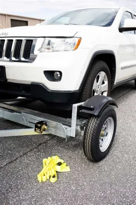 How to Tow a Car with a Truck Without a Dolly: Why Not Just Use a Giant Rubber Band Instead?